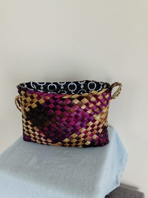 A selection of hand woven hand bags and shoulder bags