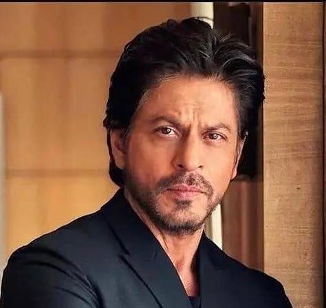 Shah Rukh Khan - the sexiest man alive. Big nose, dramatic eyebrows, dimples, and a six-pack at 58.