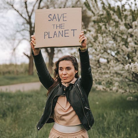 Signposts in Autumn Wood, Woman holding up Save The Planet Sign, Brick wall with ivy