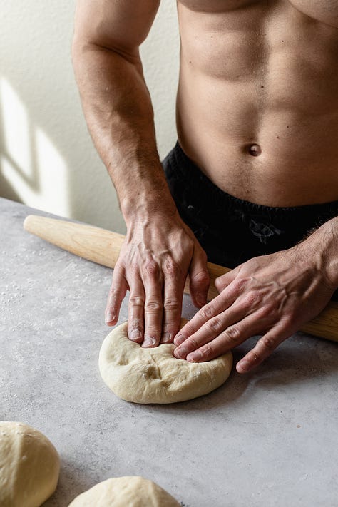 Shirtless baker in black pants making vegan milk bread loaves