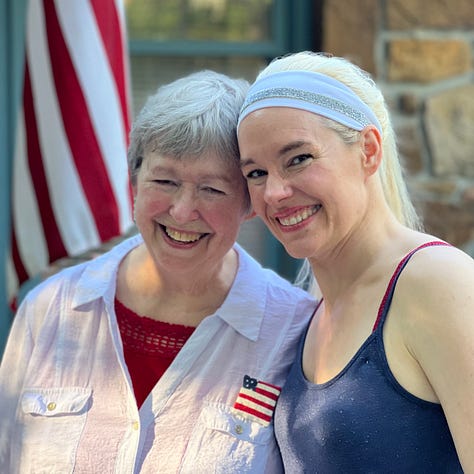 The author with her mother--both grinning huge in front of the flag at Fourth of July; mom dressed as Jack Skellington in a Santa hat playing the piano; three smiling women with similar faces in front of the turquoise Chihuly blown glass reeds.