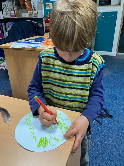 Children getting hands on in Ullapool LIbrary with Ranger Jenny