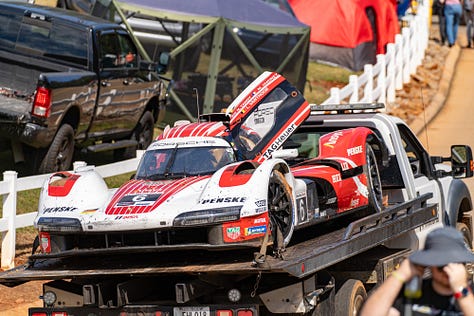 Porsche 963 GTP car, wrecked race car, tow truck