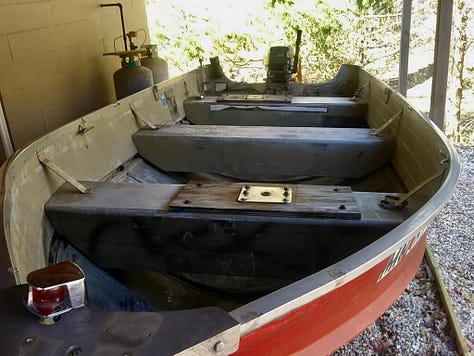 A peeling, sun-damaged, debris-filled red boat transforms into a sleek, black craft for Daddy-Daughter bonding