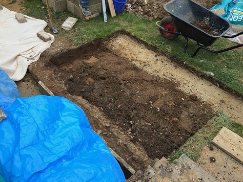 preparations of digging out the garden in preparation for the construction of the garden wall