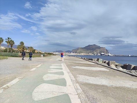 Pictures of the course show a broad concrete path for most of the path and blue skies