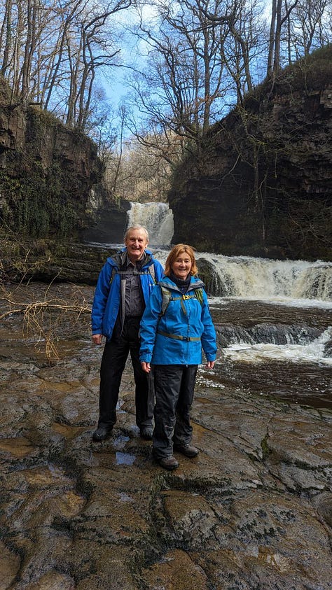 two hikers in the waterfalls area of the brecon beacons