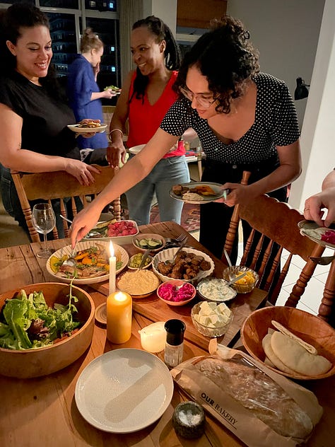 L-R: candlelit dinner table with plates of food and a dark haired woman reaching to serve food, two white women with brown hair sittling on a park bench talking to a piece of paper with a sketch on it, two white women, one blonde, one brown-haired sitting on the floor writing on a big piece of white paper