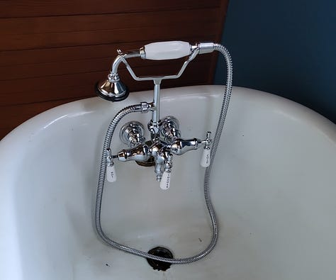 old and new faucets and washing dishes in the tub!