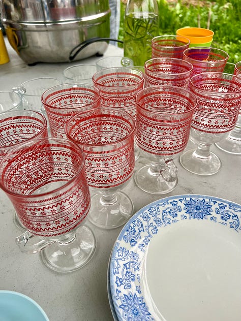 photos of ripe (bletted) medlars, the table setting, glassware and bunting decorations