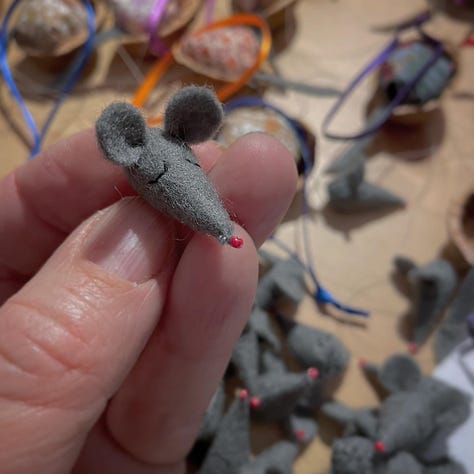 Tiny grey stitched felt mouse heads, and a small brown cardboard box with the legend Walnut Mouse Making Bits written on the side