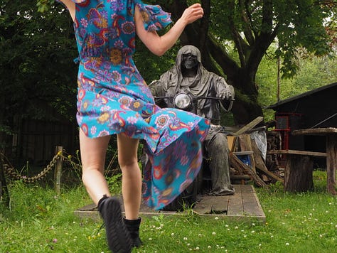 a statue of death in the backgarden