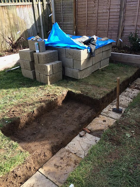 preparations of digging out the garden in preparation for the construction of the garden wall