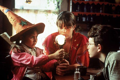 Shots from Halloweentown (1998), including the famous "Bubble, Toil, Trouble" settings on a microwave, and the kids gathered around the witch's brew cauldron and talisman