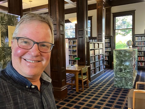 Library photos showing books, computers, and the author