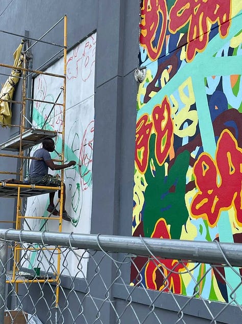 Series of nine photos depicting the evolution of my mural "Bound Together" located at 10th and Callowhill Streets in Philadelphia's Chinatown area. 