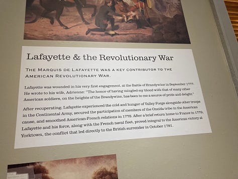 The team from Evolution Printing installs text panels for FAM's exhibit "Lafayette's World: Revolutionary Ideals and the Limits of Freedom" on February 26. The exhibit opens on Friday, March 1.