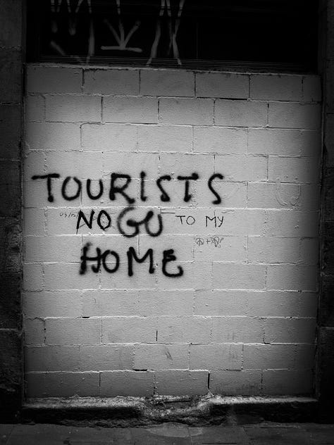 Image 1: "Tourists no go to my home" Image 2: "Tourism is killing the..." Image 3: "Tourists go home"