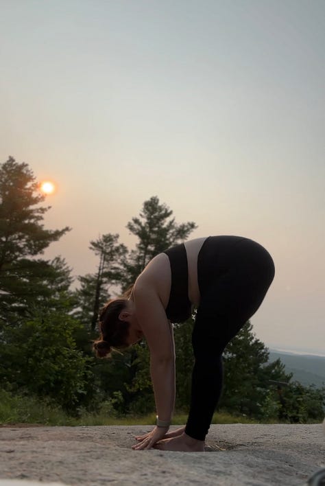 A gallery of images shows a woman standing on a mountain top with the rising sun in the background doing a series of yoga poses.