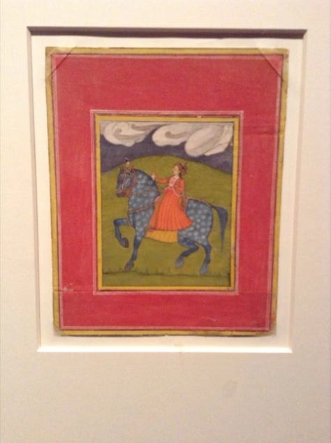 Japanese armour, a statue and a painting of man on horse
