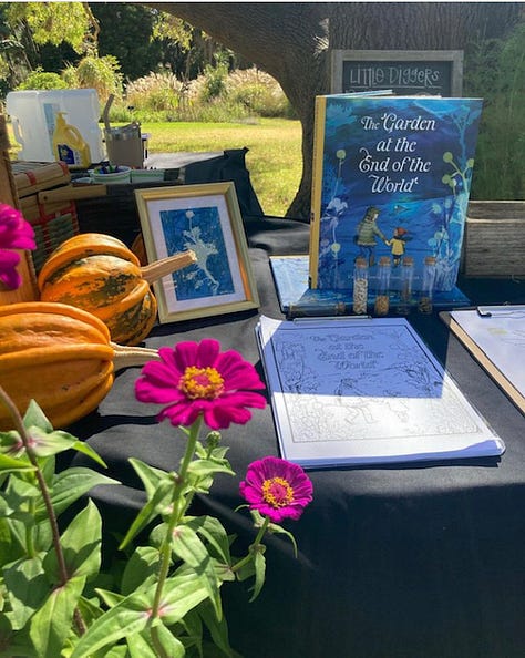 Display table with pumpkins, flowers and a copy of The Garden at the end of the World; blackboard showing activities for kids including storytime; A classroom full of kids, some with hands raised. 