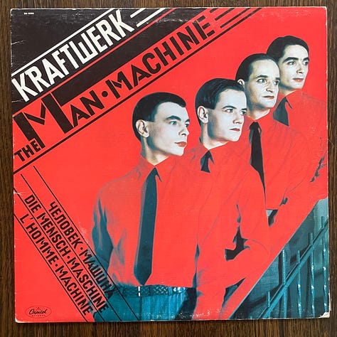 pictures of record album covers of Kraftwerk's The Man Machine, Iron Maiden, Hector Lavoe's Que Sentimeniento, Tito Puente y Celia Cruz, and Maria Freuzas