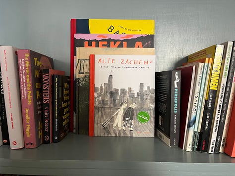 Photos of disorganised Artist book shelves and