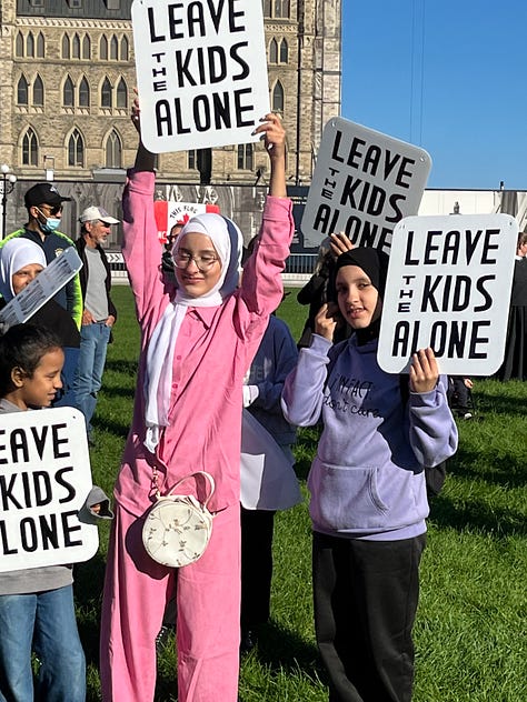 Parents and grandparents with children protested against gender ideology being forced on them in Canadian Schools. The parents and children took Parliament Hill as counter-protestors were held back on the other side of Wellington Street.