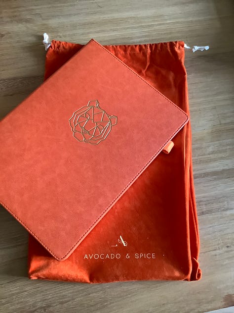 Orange notebook with velvet bag and box ready for writing poems into