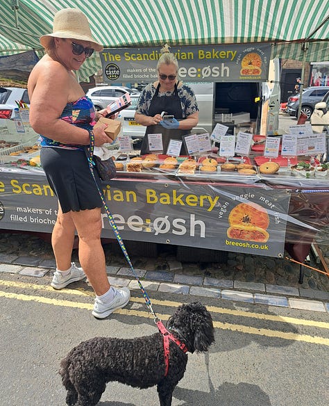 Barnard Castle farmers market; customers, dogs, Town Crier