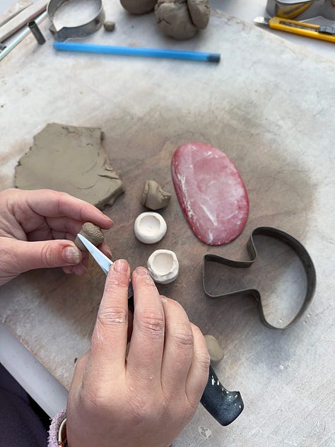 3 images showing the journey from a ball of clay being sculpted by hand to a finished pendant.