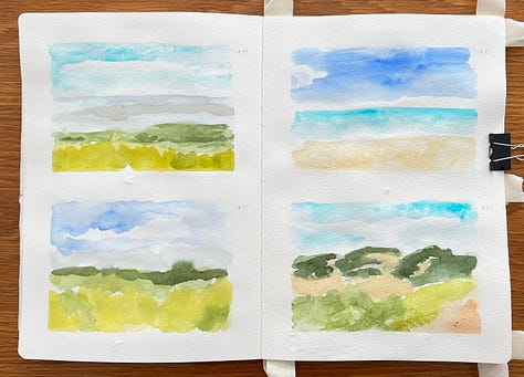Watercolour landscapes in a sketchbook