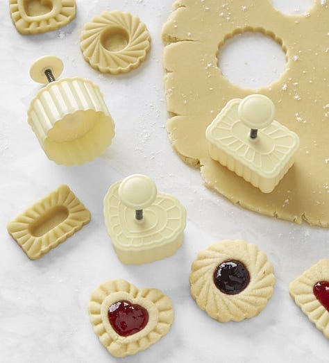 From left: Silpat cookie sheet, the cover of the Crumbs cookbook, cookie stamps with cookie dough and unbaked cookies.