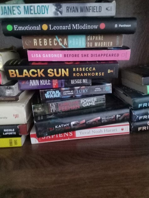 Photos of piles of books on all kinds of subjects, mostly either fiction or popular science