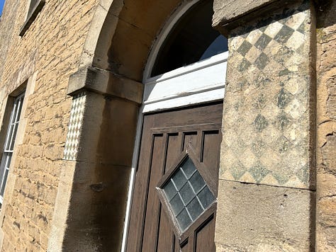 3 photos. One is the Lacock Road side of the Methuen Arms. The other two zoom in on the Post Office sign from c1800 and the chequer signs either side of the doorway. Images: Roland's Travels