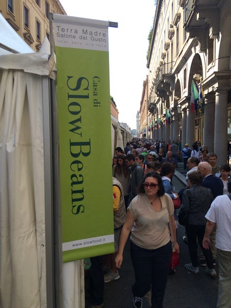 A selection of foods including eggs, cheese, nuts and people from past Terra Madre events