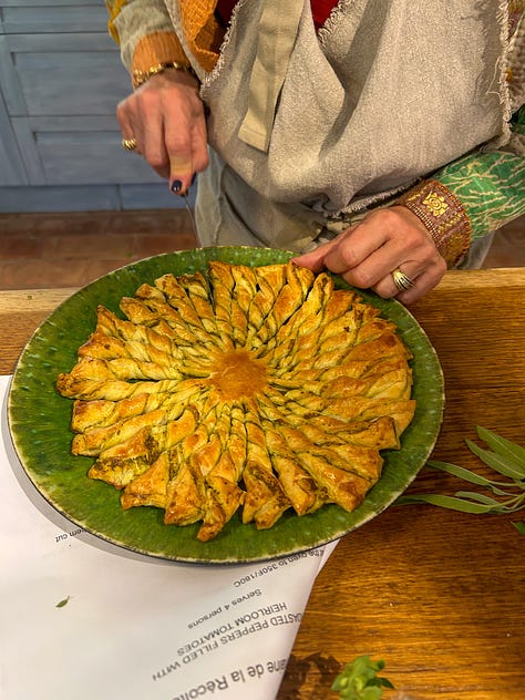 Colorful flowers, a tarte au soleil appetizer with pesto, and lunch on a pretty terrace