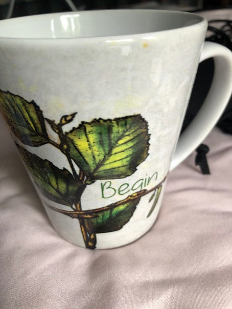 Three images — one with a solarpunk mug, captioned August Giveaway: Books, Mugs, and Gorgeous Art Notebooks, one with a spruce drawing and the word BEGIN, one with a blank notebooks with a harvest image on the front