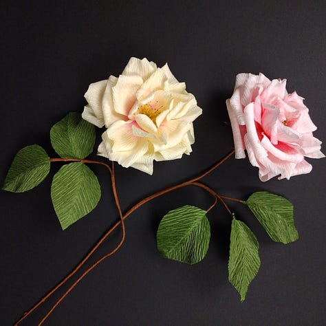 A series of paper flowers created in my classes this week: bright yellow forsythia, soft blue Iris and classic pink and cream roses
