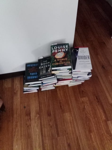 Photos of piles of books on all kinds of subjects, mostly either fiction or popular science