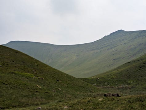 wild swimming on pen y fan in the brecon beacons