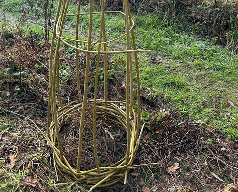 Stems of willow bound at base and top and then a completed obelisk