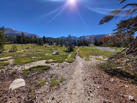 Tall granite mountains with paths leading to sights unknown