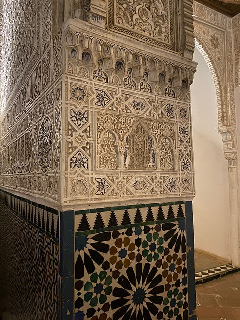 9 photos showing various views of interior parts of the Alhambra. Details of the Islamic calligraphic writing and various patterns carved into the walls.