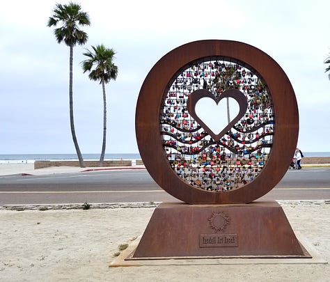Heart sculpture in Oceanside, California with 3 pictures, one showing a close up of the locks, one of the sculpture with many locks and one with just a few locks when the sculpture was first installed.
