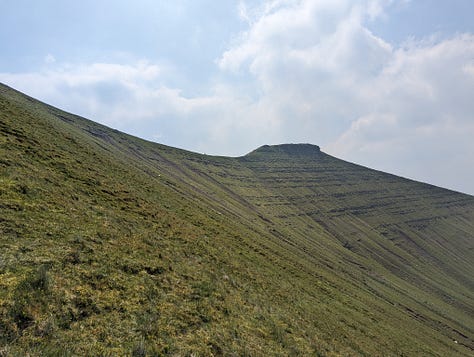 wild swimming on pen y fan in the brecon beacons