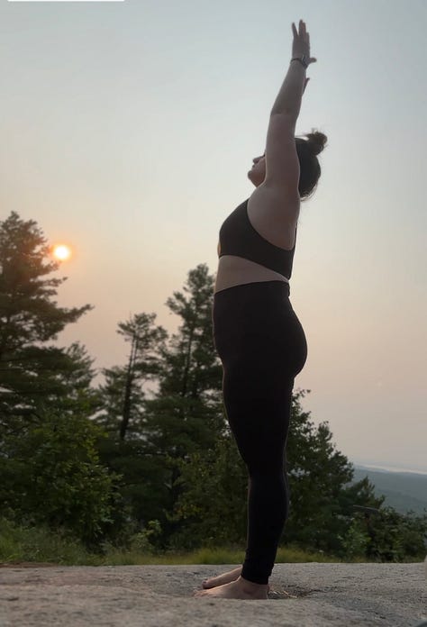 A gallery of images shows a woman standing on a mountain top with the rising sun in the background doing a series of yoga poses.