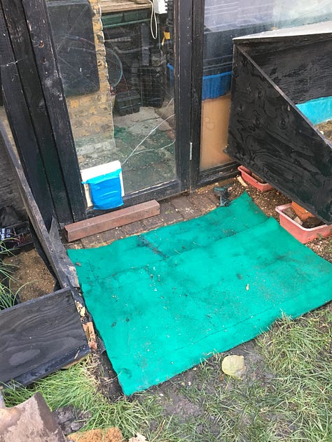 An under-stairs cupboard, with its own set of stairs, being cleaned out like something from a horror film; Green matting used to improve the entrance to the glasshouse; Jute matting salvaged from the skip for the staff room entrance.