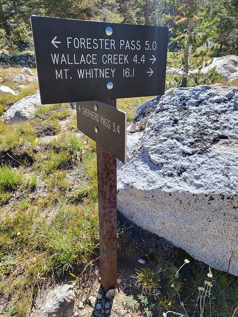 Tall granite mountains with paths leading to sights unknown