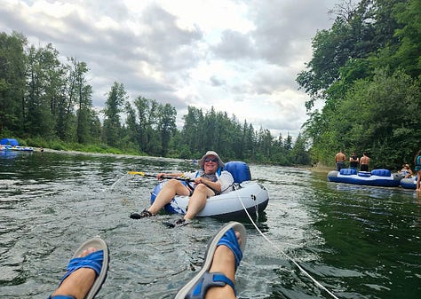 Floating on a river, kayak by the lake, Kacey holding a basketball